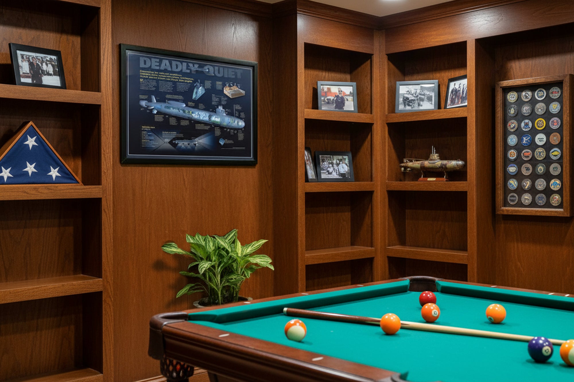 Game room with pool table, bookshelves, and framed pictures.